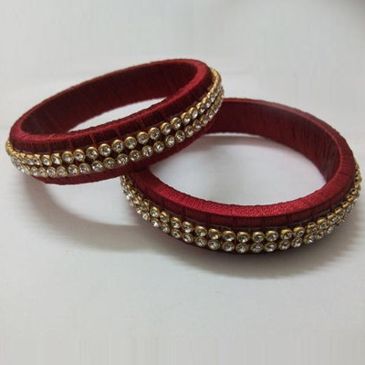 Pair of red silk thread bangles with stone work